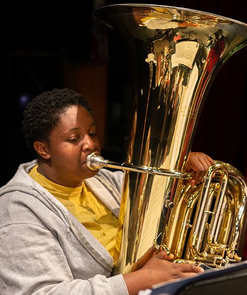 Student playing the tuba