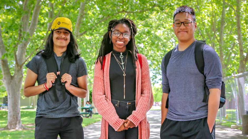 Three CRC students on campus, smiling