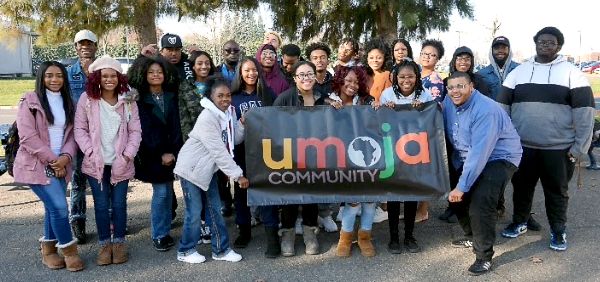 Umoja group holding banner