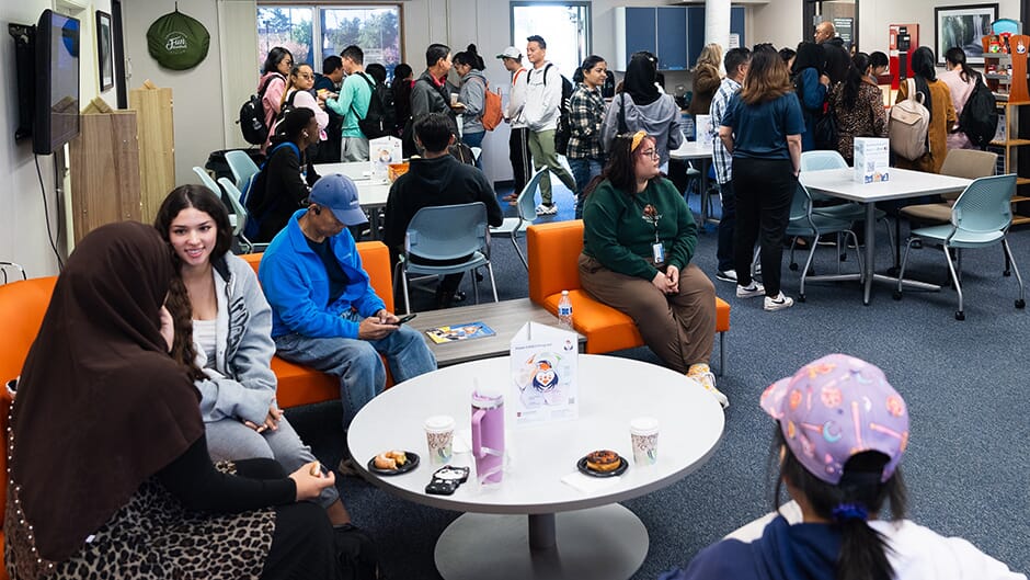 Students gathering in the Hawk Cares Lounge