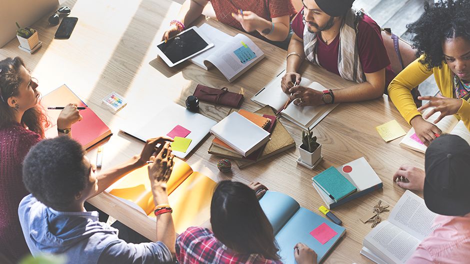 A bird's eye view of students at a table together