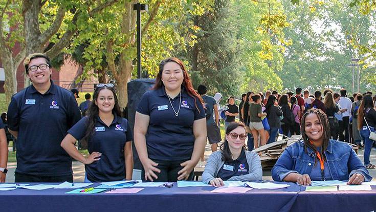 Students welcoming other students to campus