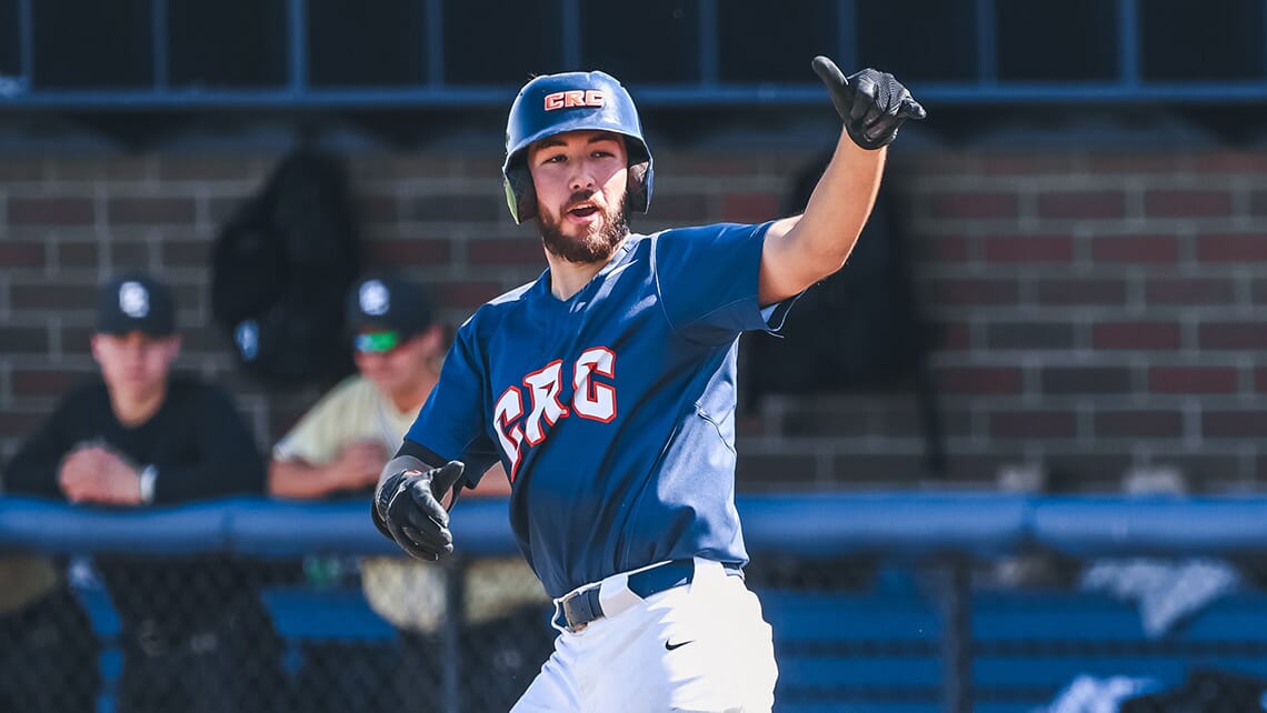 CRC baseball player rounding home plate