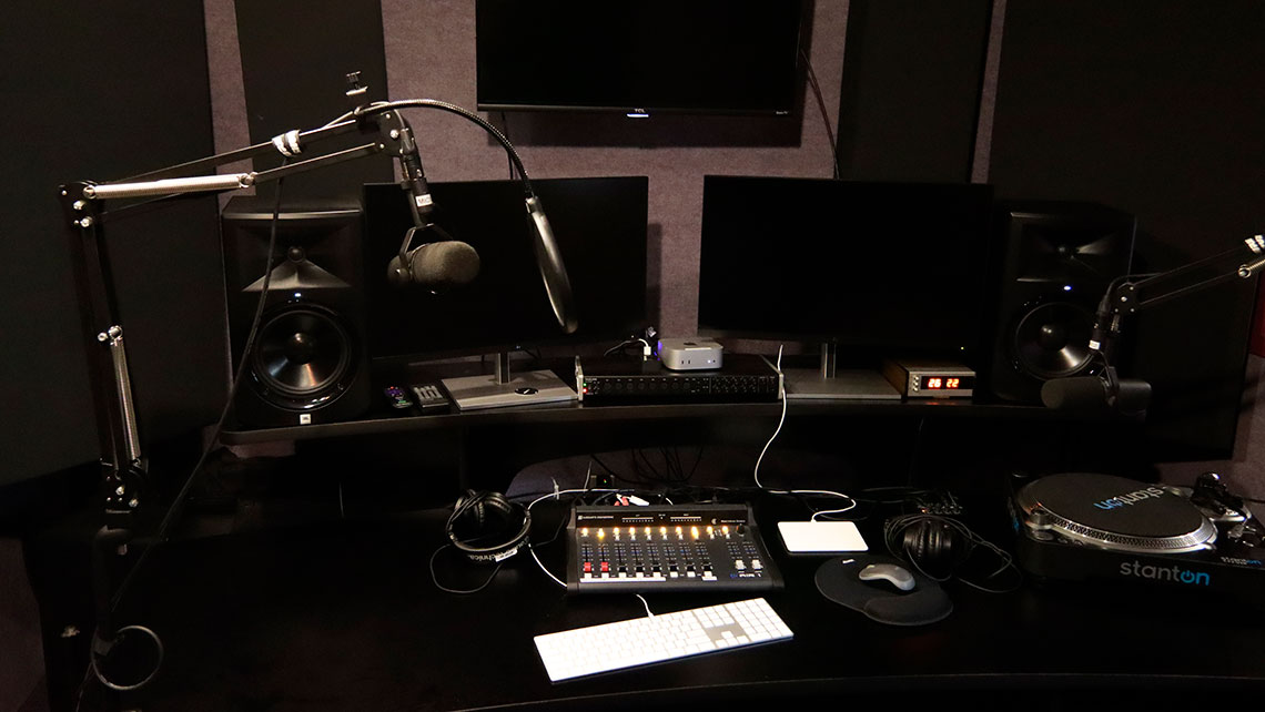 Podcast equipment; microphone, keyboard, mixing station