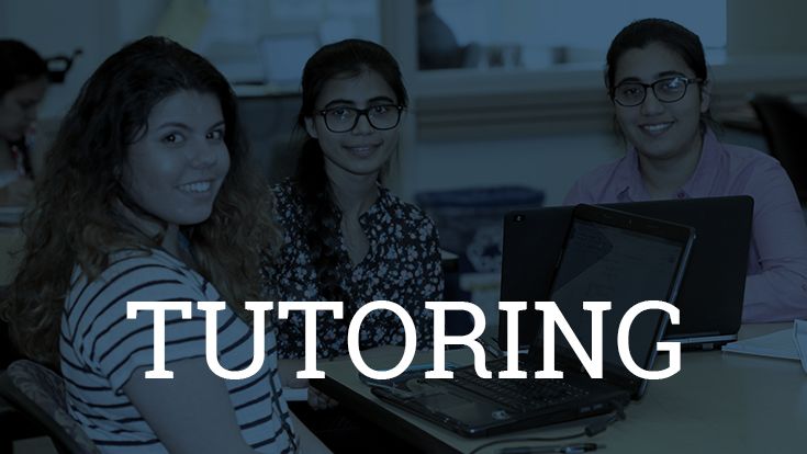 Three students working at a table, and the word Tutoring