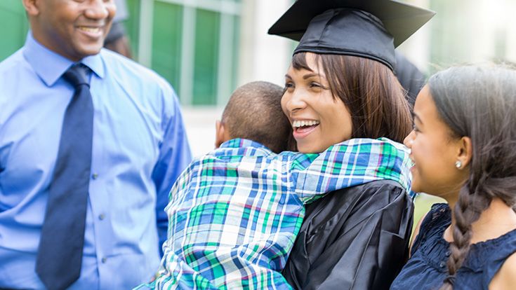 Graduating mom receiving congratulations from her family